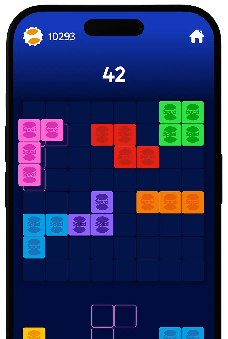 Mockup eines Smartphones mit einem bunten Blockpuzzle-Spiel namens Spezi Block Challenge. Auf dem Bildschirm sind unterschiedlich farbige Blöcke auf einem Raster platziert, darüber eine Punktzahl von 42.